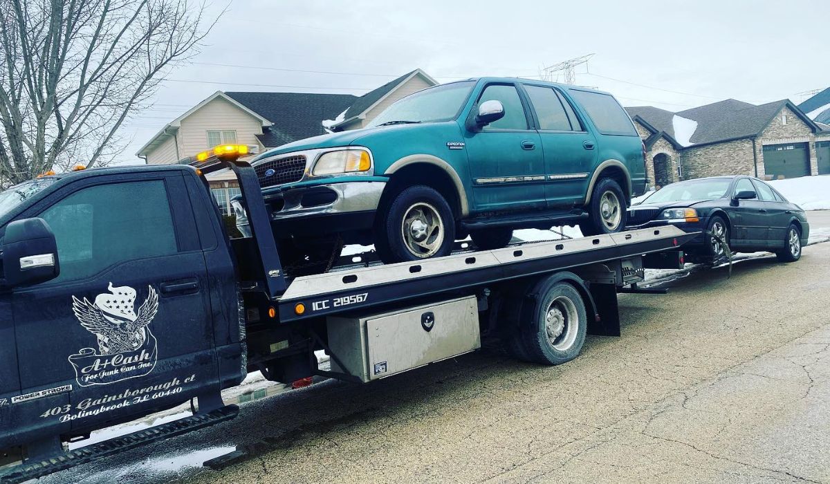 a towing vehicle pulling a Ford Expedition SUV