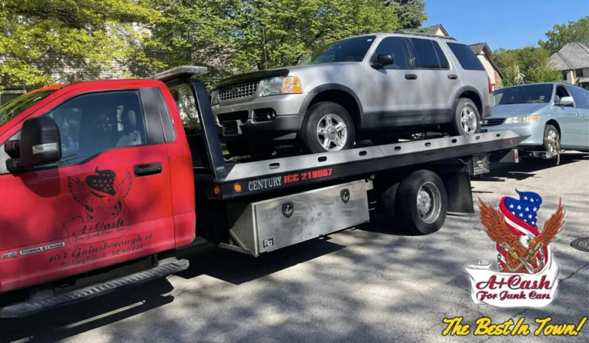 a junk car being towed by a cash for junk cars company