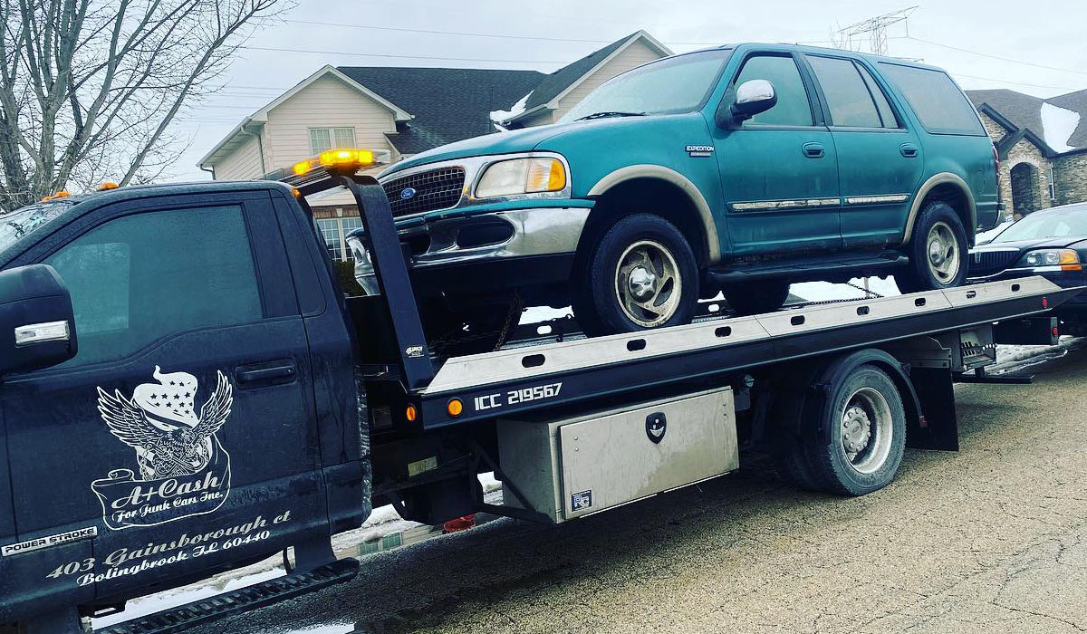 a junk being towed, sell junk cars for cash