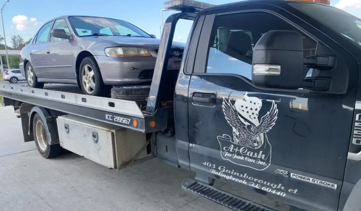 Tow truck from A+ Cash For Junk Cars Inc., trusted junk car buyers in Crest Hill, IL, loading a vehicle for free same-day removal and cash pickup.