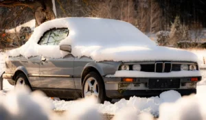 Unplated car covered in snow showing winter urgency when selling a car without plates in Crest Hill