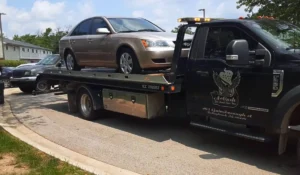 Cash for Junk Cars removing an abandoned vehicle from a Chicago suburban neighborhood.